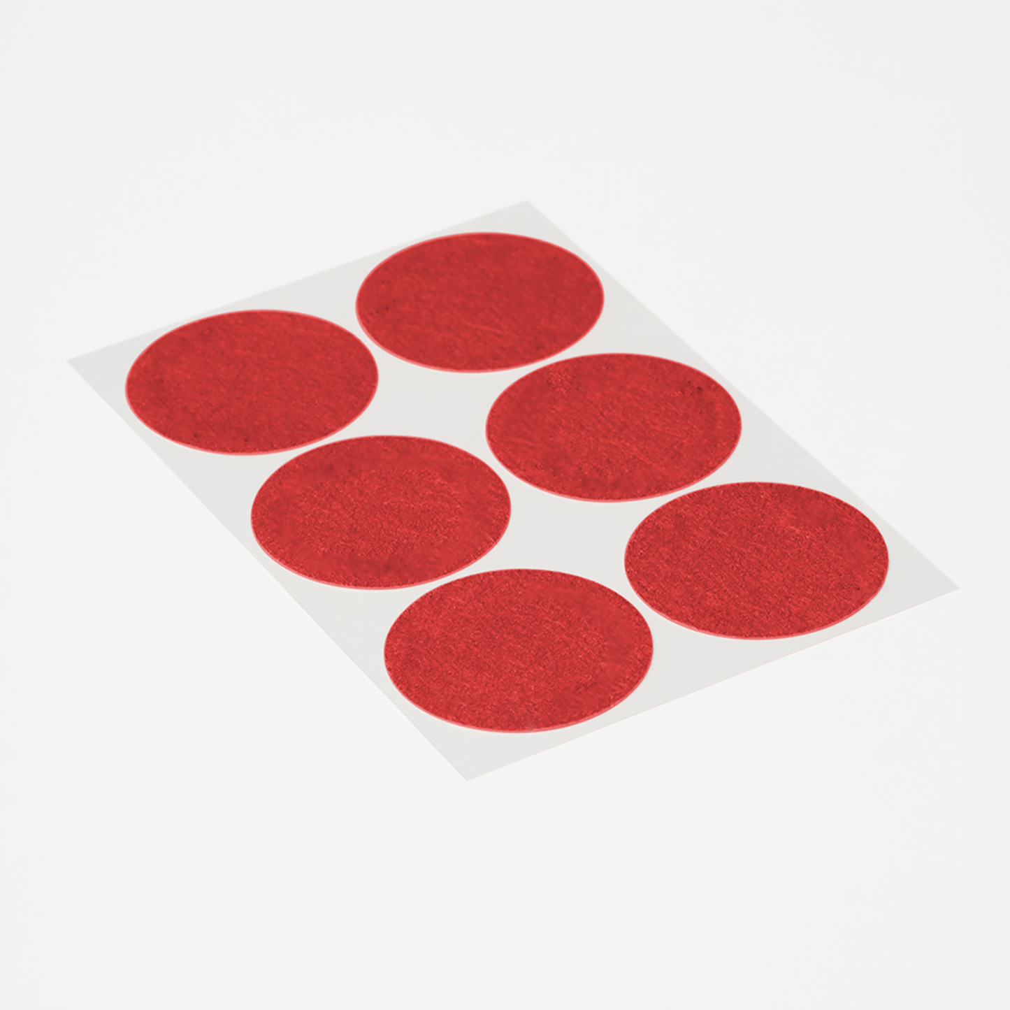 Sheet of round red Period Relief Patches Extra Strong