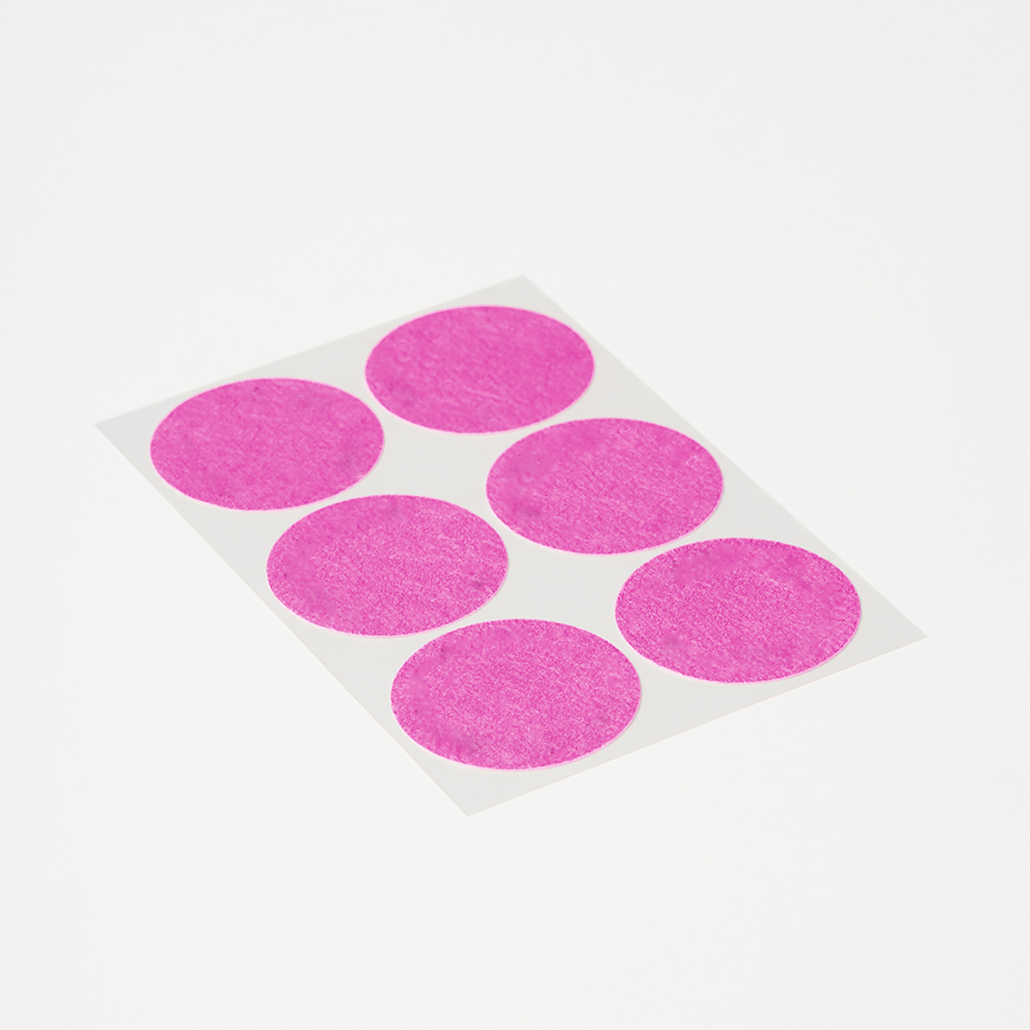 Sheet of round pink Menopause Patches for menopause symptom support