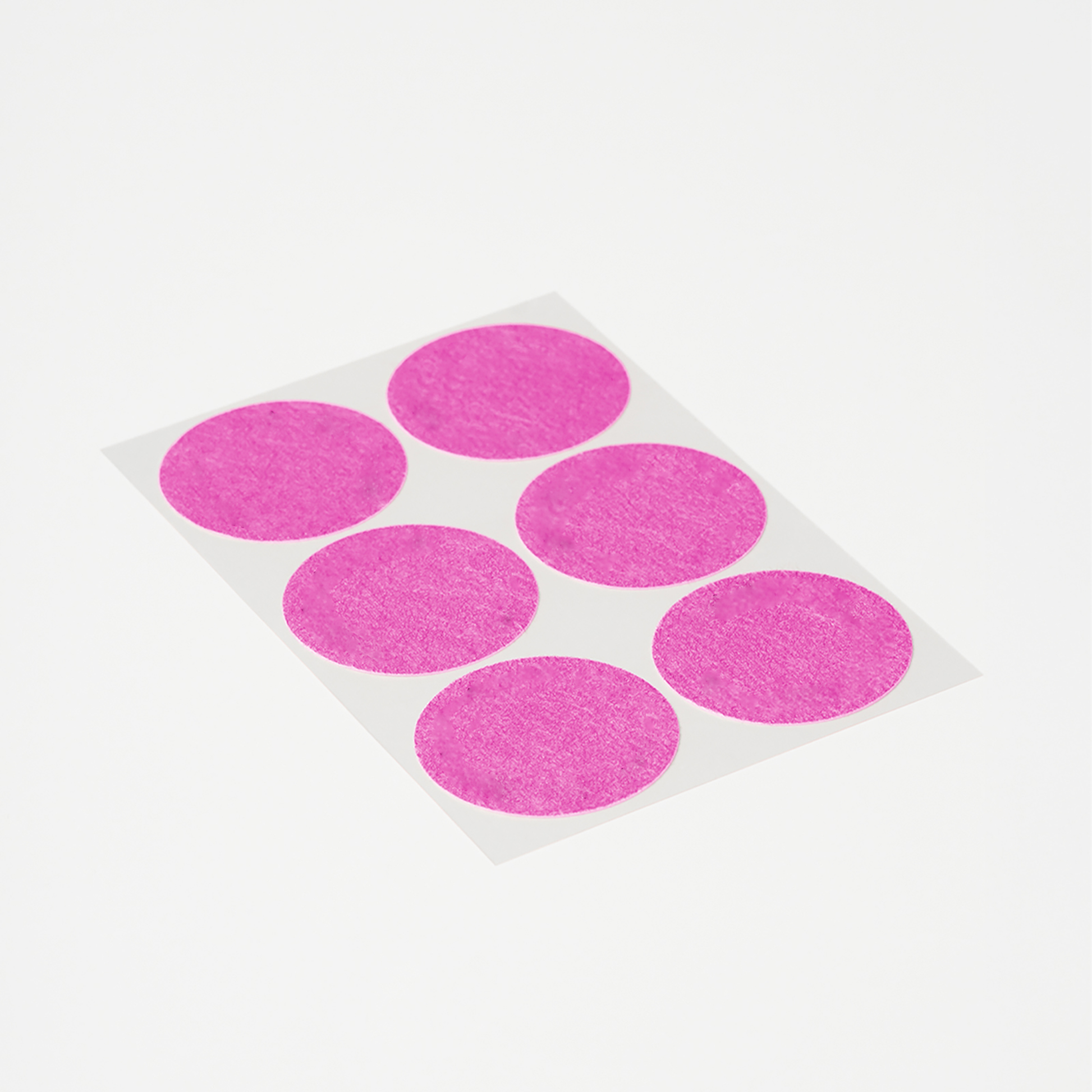 Sheet of round pink Menopause Patches for menopause symptom support